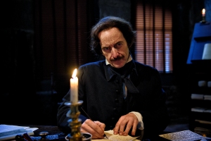 Edgar Allan Poe (Denis O'Hare) takes pen to hand on AMERICAN MASTERS. Photo: Liane Brandon.